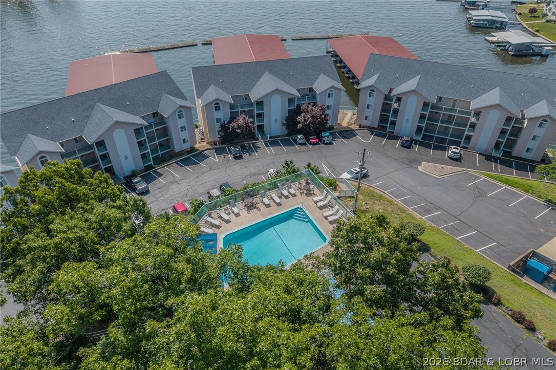 194 Sac Road, Unit D301 Sunrise Beach, MO 65079 - Photo 40 of 43 Aerial view of community pool and docks