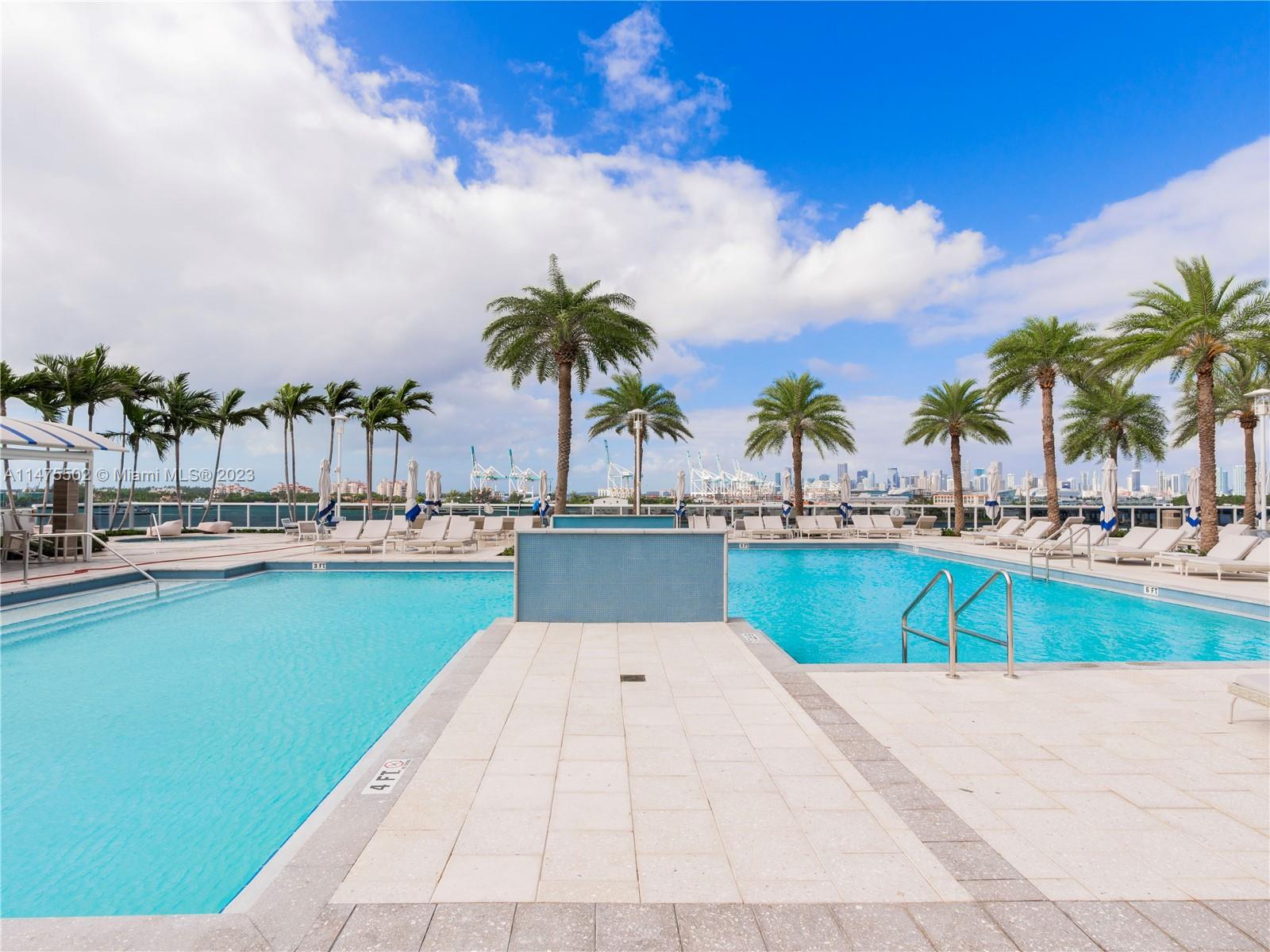 400 Alton Road, Unit 1104 Miami Beach, FL 33139 - Photo 20 of 27 a view of swimming pool with outdoor seating and lake view