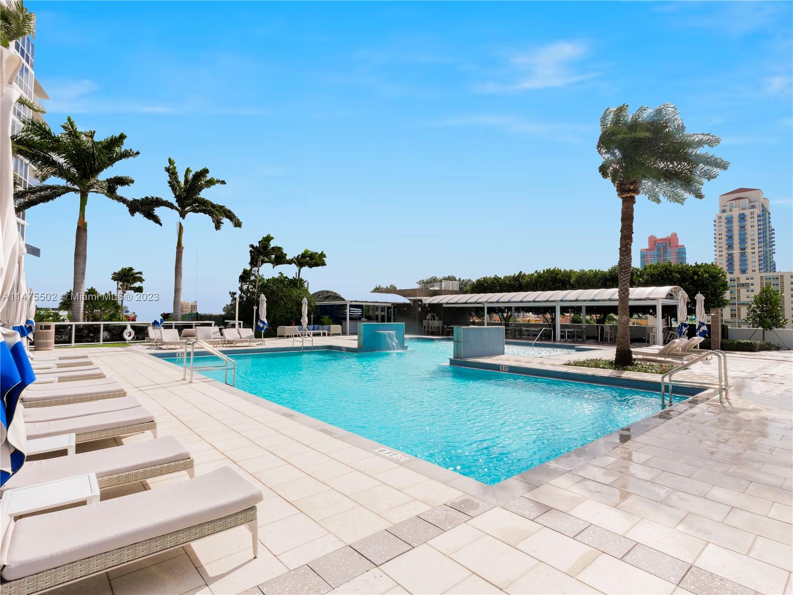 400 Alton Road, Unit 1104 Miami Beach, FL 33139 - Photo 26 of 27 swimming pool view with a seating space