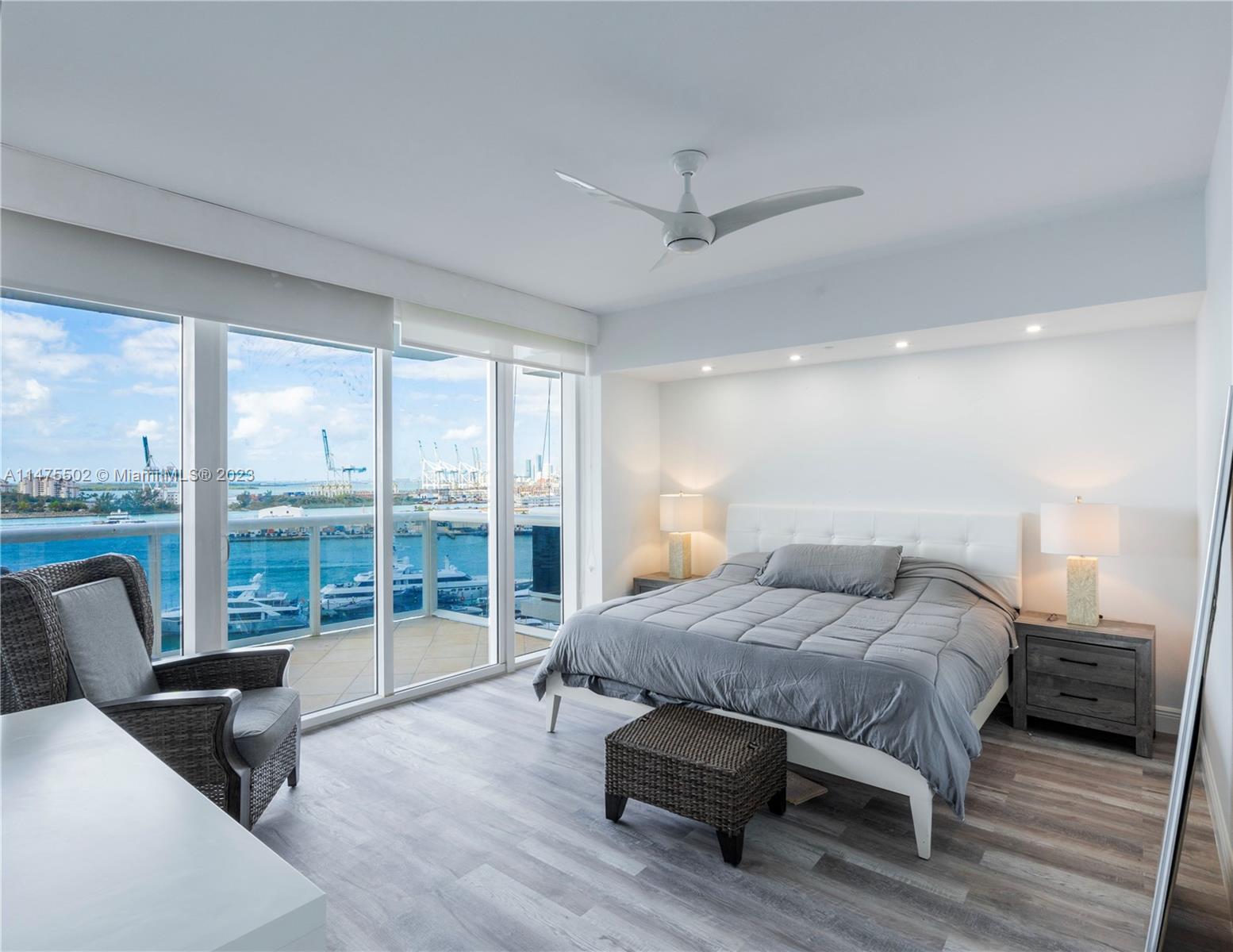 400 Alton Road, Unit 1104 Miami Beach, FL 33139 - Photo 9 of 27 a bedroom with a bed and wooden floor