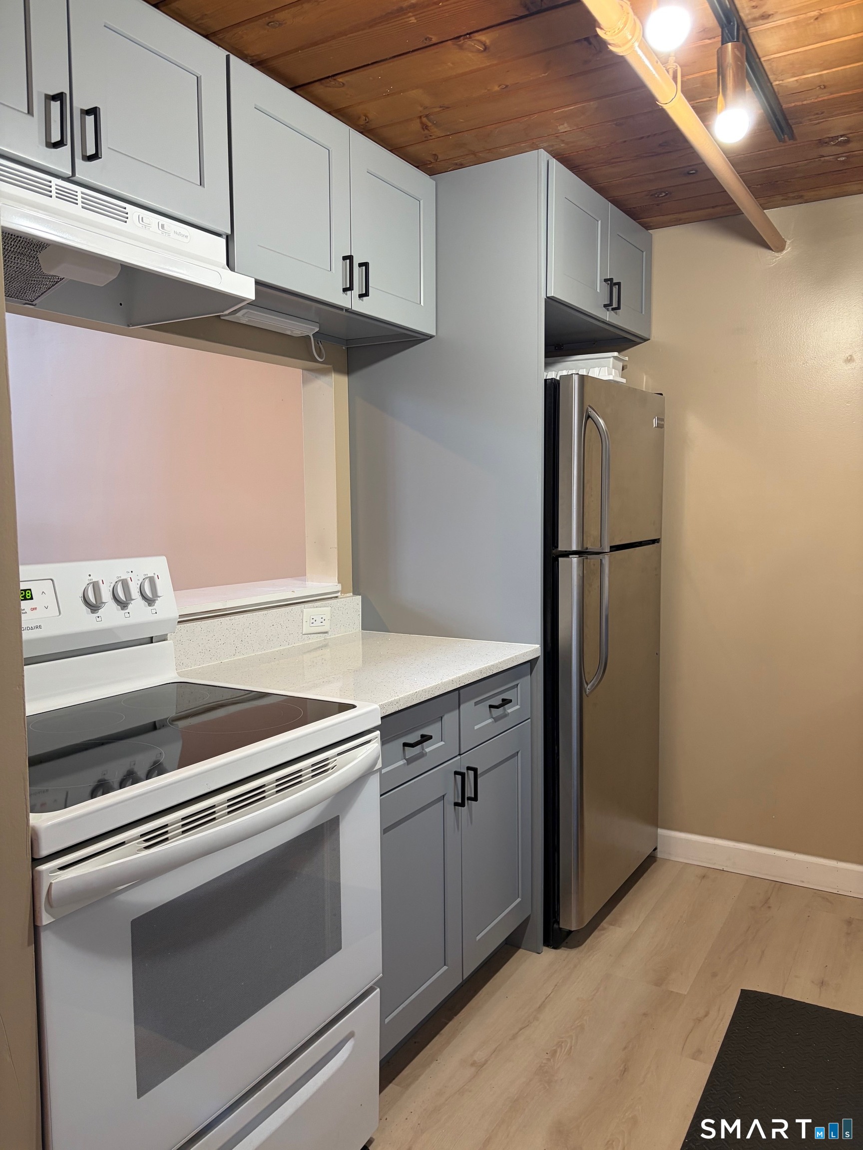839 Main Street, Unit 73 Torrington, CT 06790 - Photo 14 of 22 a kitchen with a stove cabinets and microwave