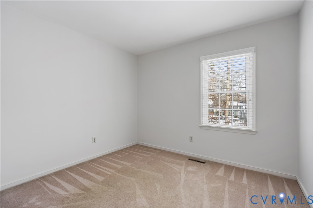 351 Walton Park Road Midlothian, VA 23114 - Photo 10 of 29 Empty room with light colored carpet and baseboard