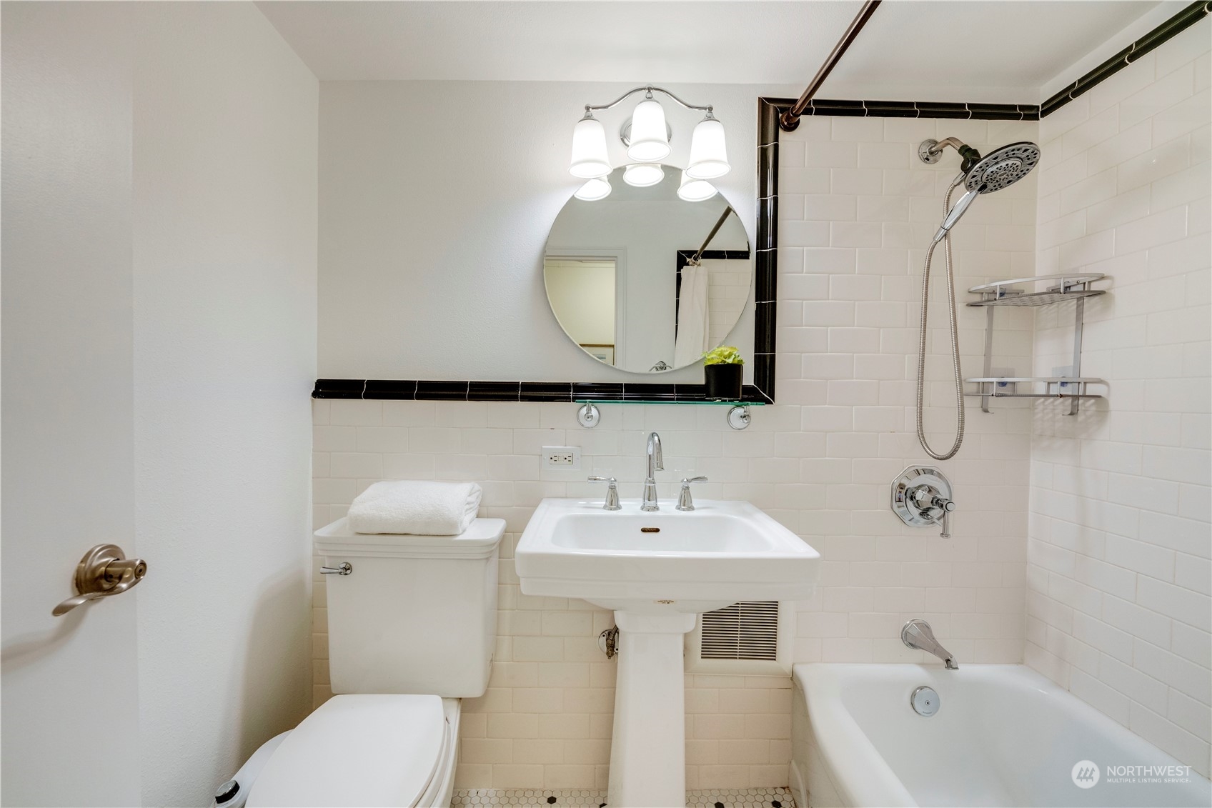 1105 Spring Street, Unit 309 Seattle, WA 98104 - Photo 22 of 39 a bathroom with a sink a toilet and shower