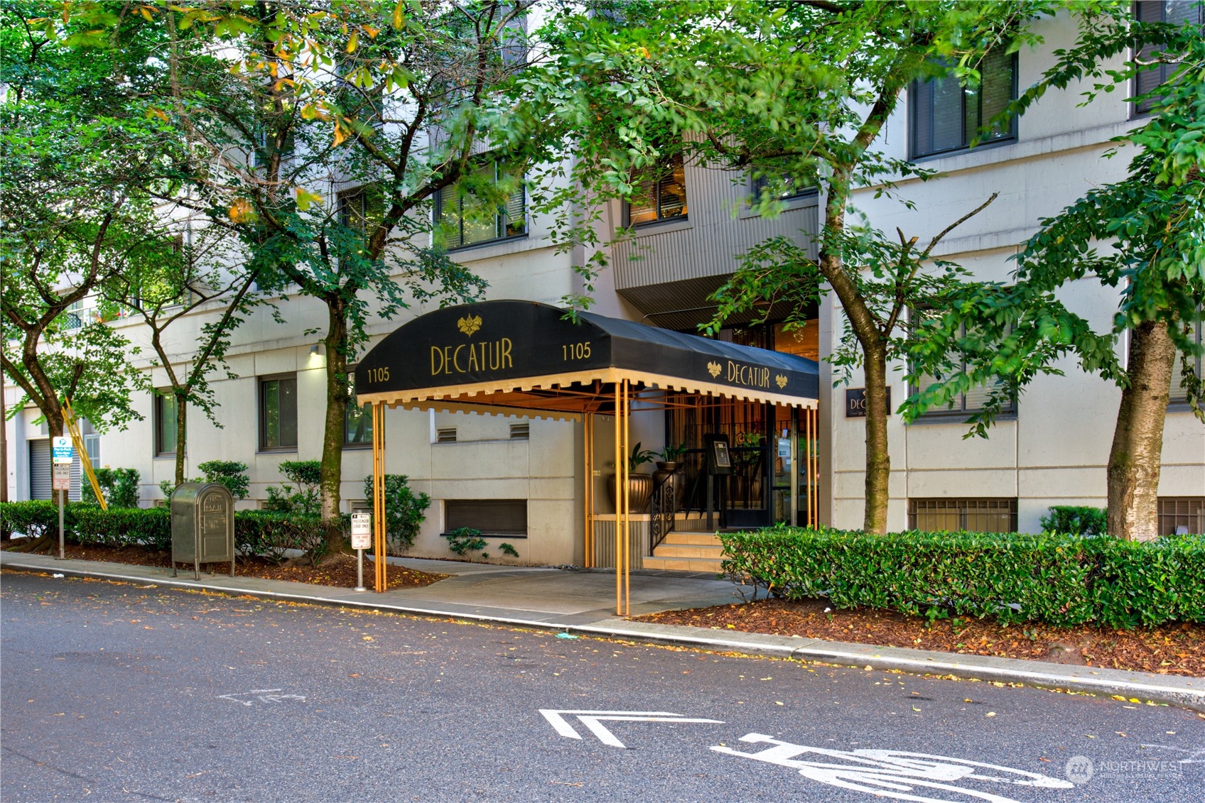 1105 Spring Street, Unit 309 Seattle, WA 98104 - Photo 24 of 39 a front view of a building with garden
