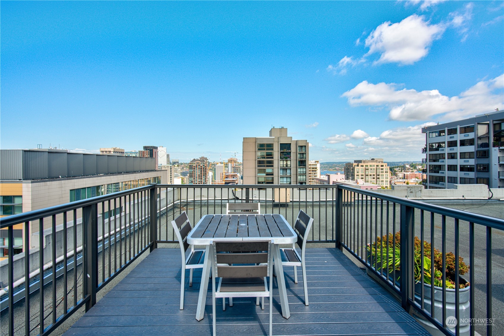 1105 Spring Street, Unit 309 Seattle, WA 98104 - Photo 25 of 39 a view of a balcony with furniture