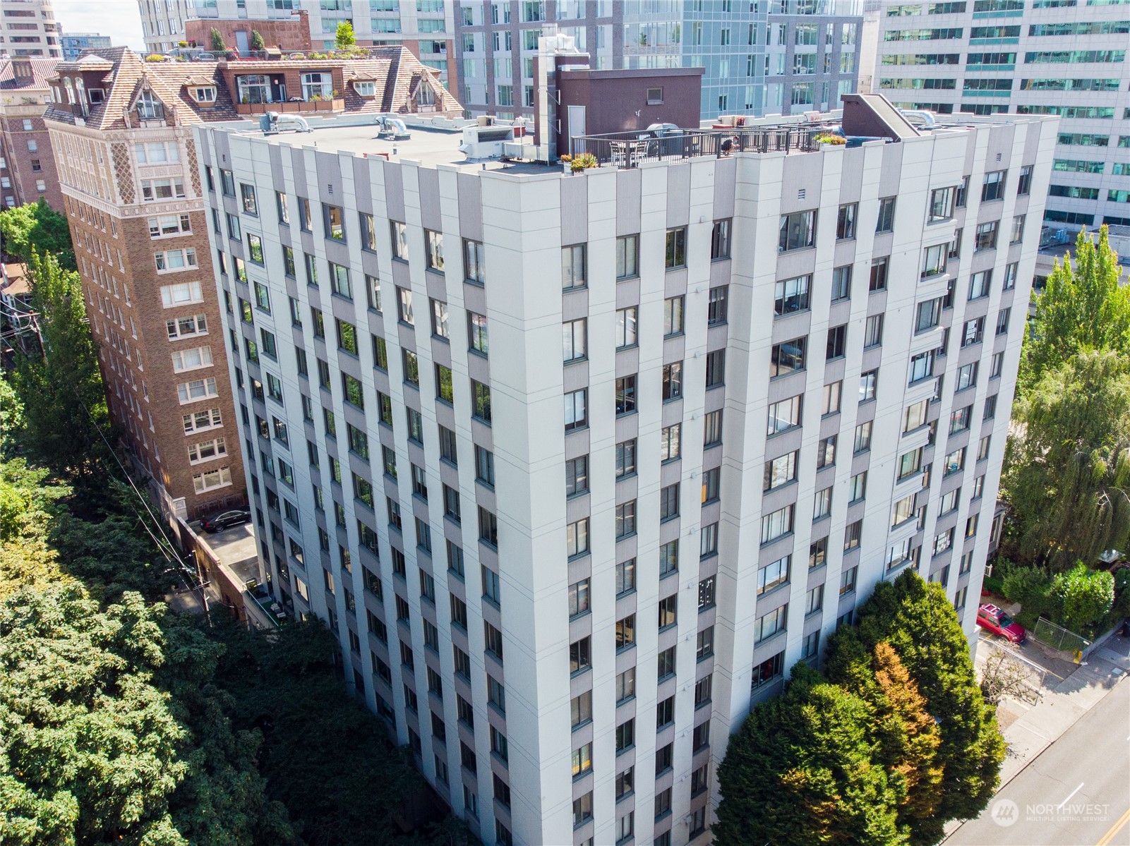 1105 Spring Street, Unit 309 Seattle, WA 98104 - Photo 29 of 39 a view of a building with a garden