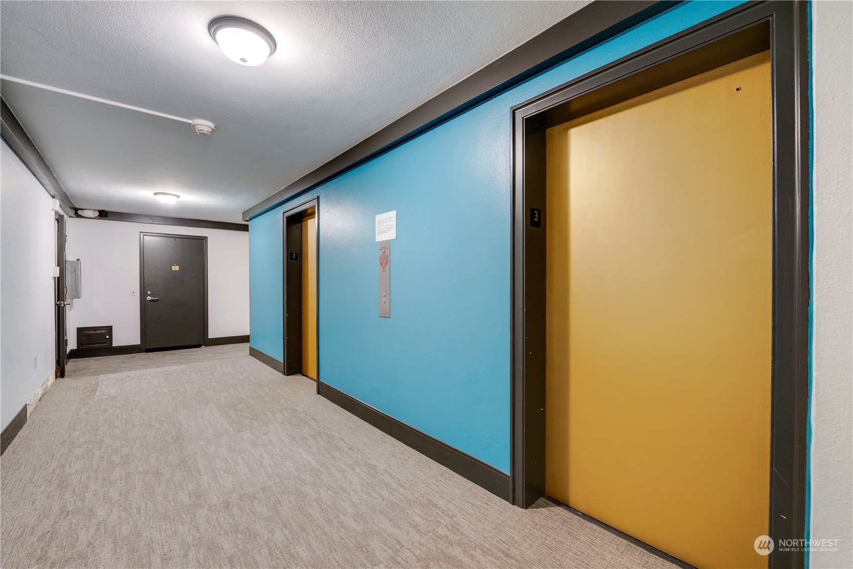1105 Spring Street, Unit 309 Seattle, WA 98104 - Photo 31 of 39 a view of hallway with a large window