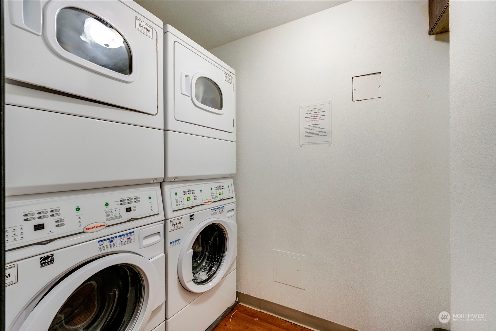 1105 Spring Street, Unit 309 Seattle, WA 98104 - Photo 32 of 39 a utility room with dryer and washer