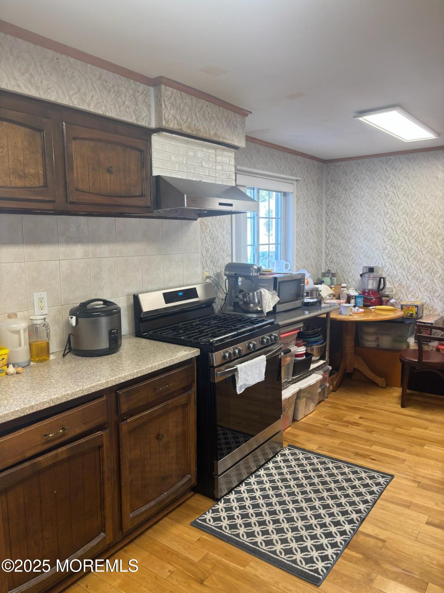 7 Candy Court Edison, NJ 08817 - Photo 13 of 18 a kitchen with stainless steel appliances granite countertop a sink stove and cabinets