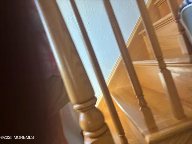 a view of a refrigerator in kitchen and wooden floor