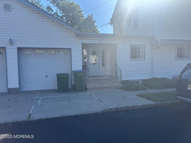 a view of an house with backyard and swimming pool