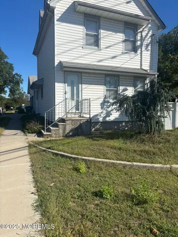 a view of a swimming pool with an outdoor space and seating area