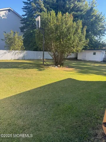 a view of a wooden fence