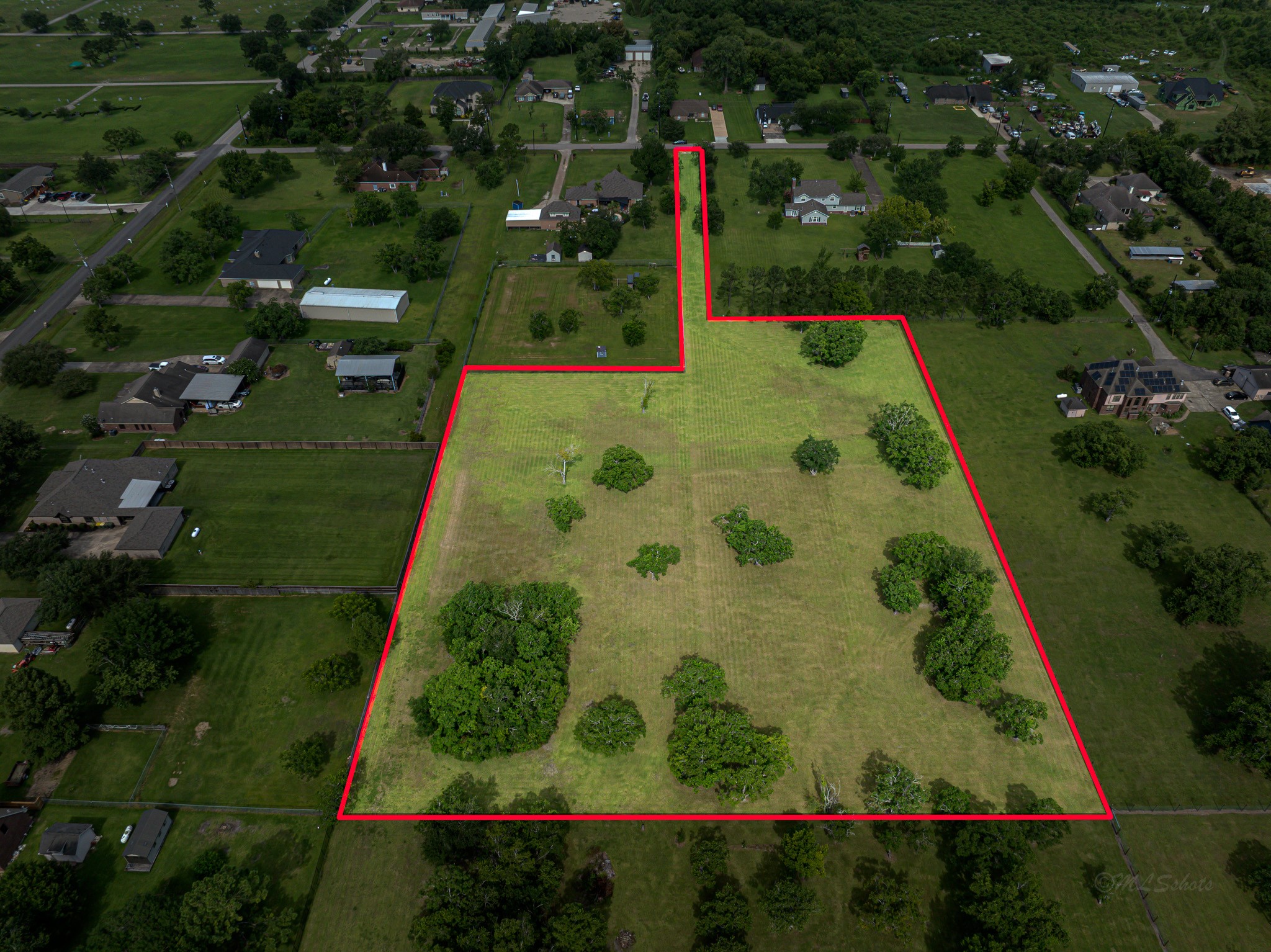 an aerial view of residential house with outdoor space