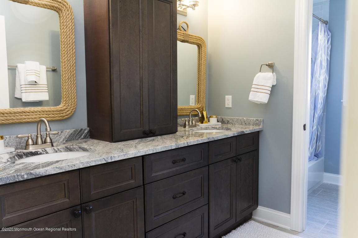 112 Alhama Drive Brick, NJ 08723 - Photo 2 of 3 a bathroom with a sink and a mirror