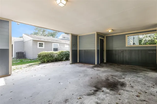 a view of a house with a backyard and a garage