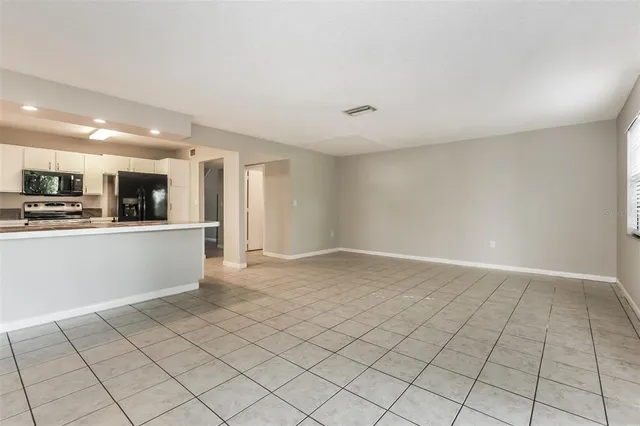 a view of a kitchen with microwave and cabinets