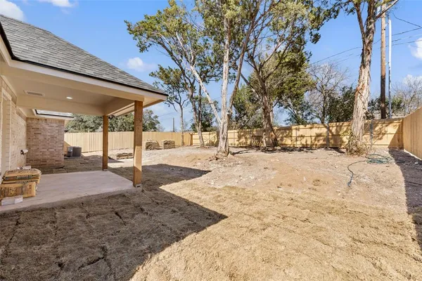 a view of a yard covered in snow
