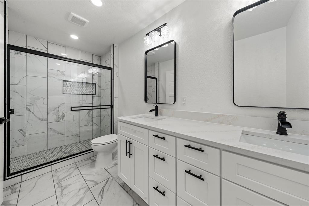 2509 Stewart Drive Waco, TX 76708 - Photo 9 of 17 a bathroom with a toilet sink and shower