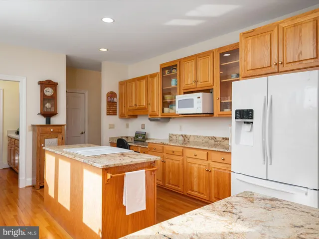 a white bath tub sitting in a bathroom next to a window