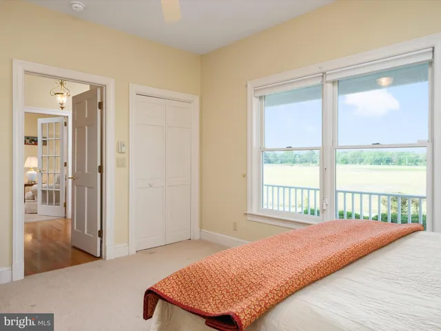 a view of a house with sitting area and a yard