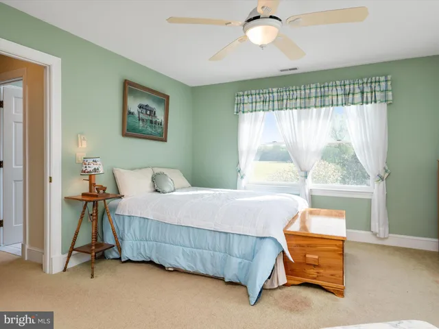 a view of a lake in front of city and mountain