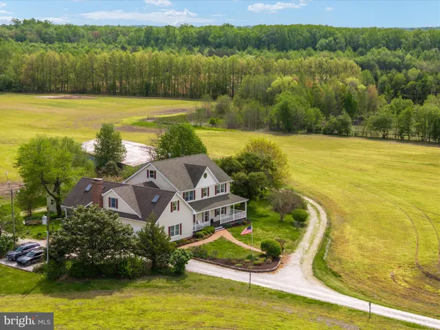an aerial view of residential house with outdoor space