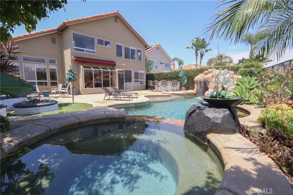 a front view of a house with swimming pool