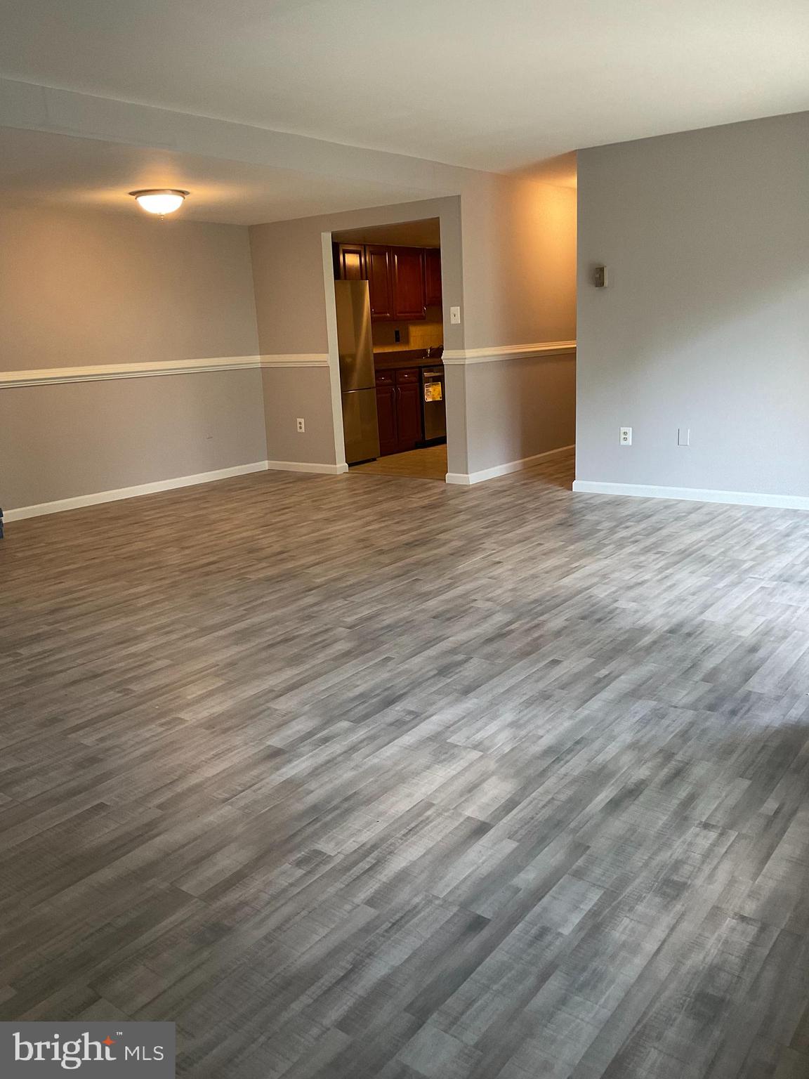 4509 Romlon Street, Unit 102 Beltsville, MD 20705 - Photo 3 of 22 a view of a room with wooden floor
