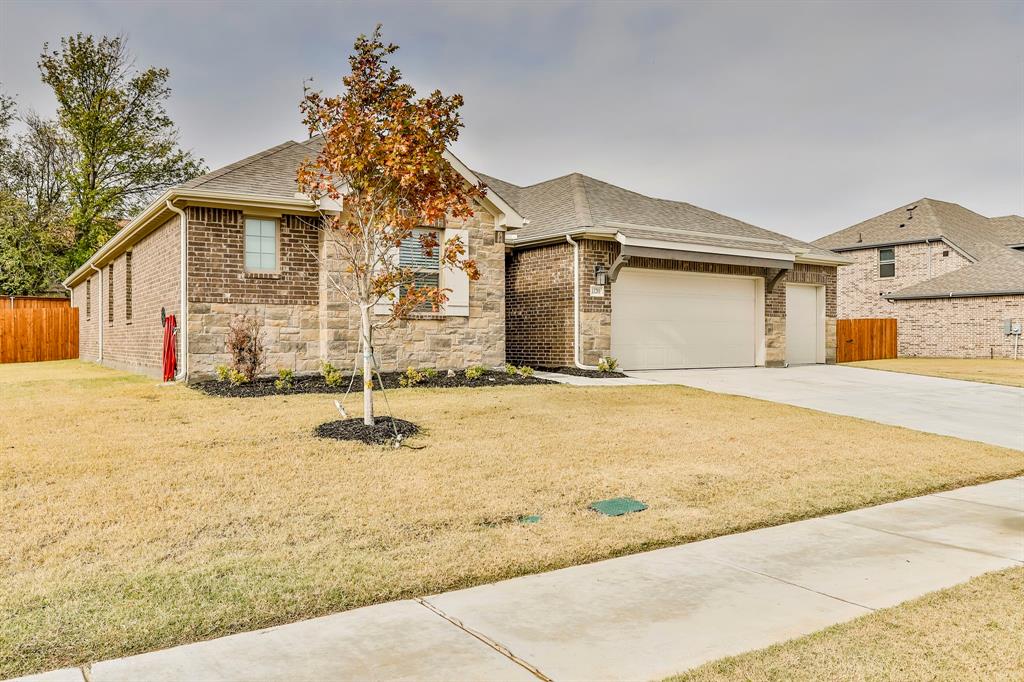 13201 Ridings Drive Haslet, TX 76052 - Photo 1 of 1 a front view of a house with a yard