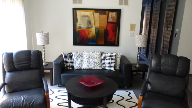 3 Commons Drive Palos Park, IL 60464 - Photo 2 of 9 a living room with furniture and a flat screen tv
