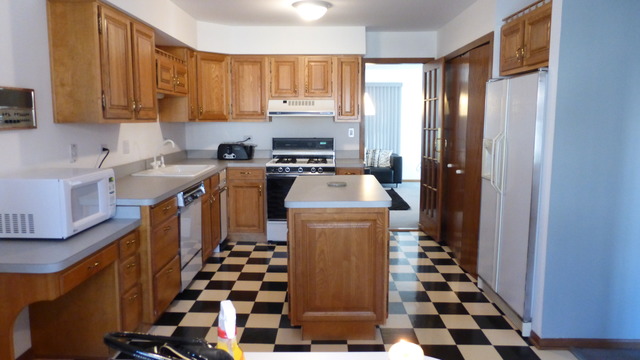 3 Commons Drive Palos Park, IL 60464 - Photo 7 of 9 a kitchen with a stove a sink and a refrigerator