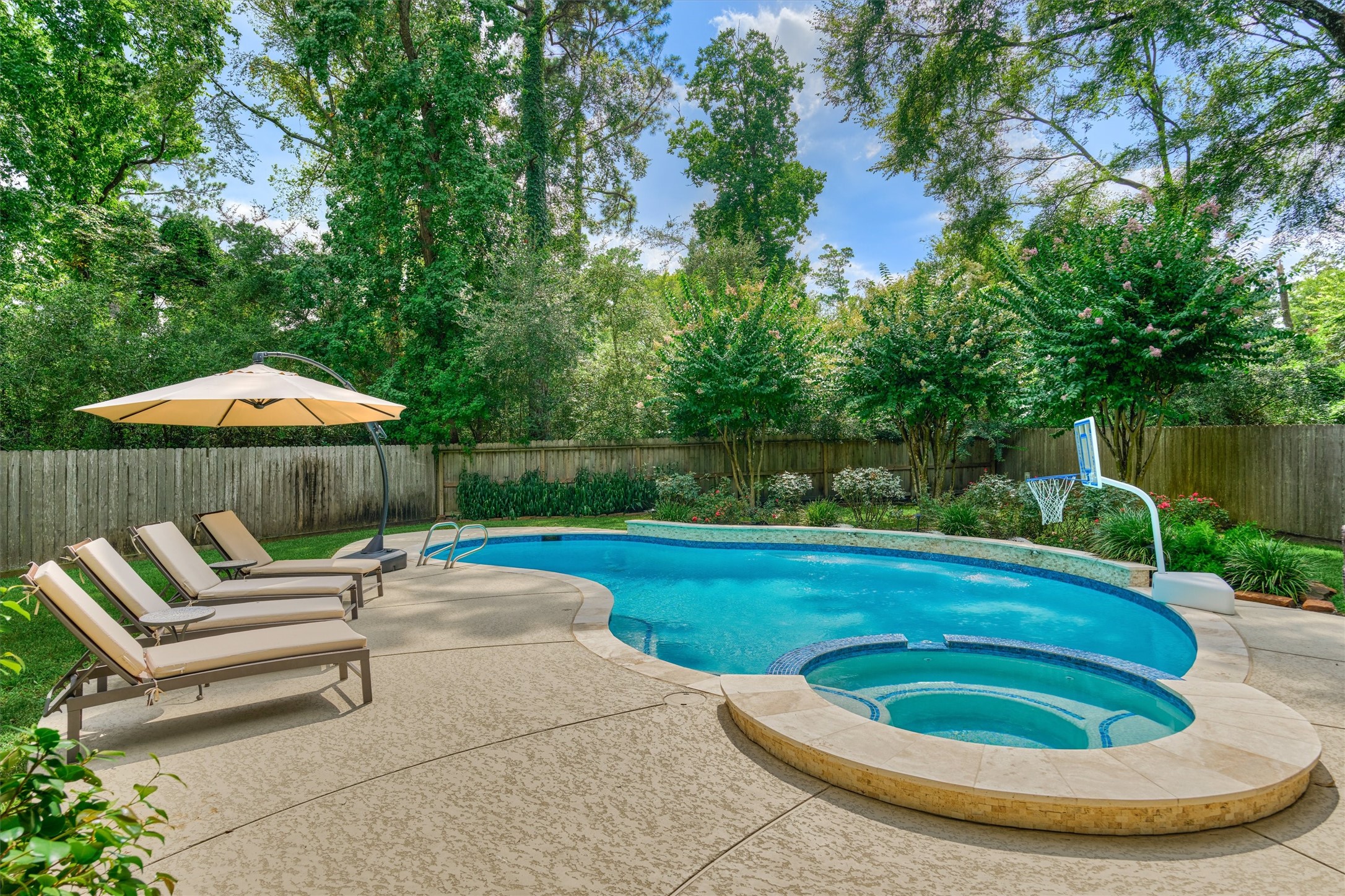 18 Treevine Court The Woodlands, TX 77381 - Photo 44 of 50 Step outside to your sparkling pool and spa, surrounded by mature landscaping and exceptional privacy throughout.