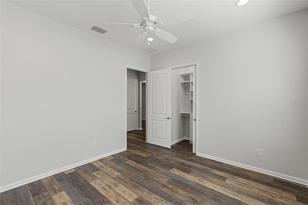 11202 Roz Way Oxford, FL 34484 - Photo 29 of 44 wooden floor in an empty room