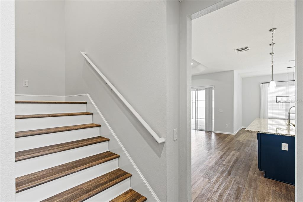 11202 Roz Way Oxford, FL 34484 - Photo 34 of 44 a view of entryway and hall with wooden floor