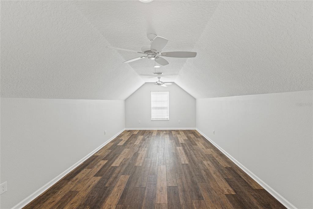 11202 Roz Way Oxford, FL 34484 - Photo 35 of 44 wooden floor in an empty room with a window
