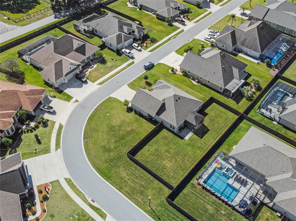 11202 Roz Way Oxford, FL 34484 - Photo 42 of 44 an aerial view of a house with a swimming pool