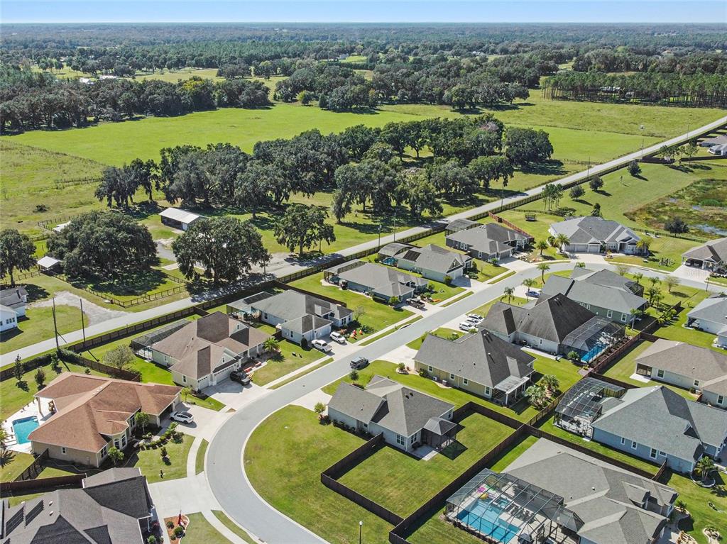 11202 Roz Way Oxford, FL 34484 - Photo 43 of 44 an aerial view of a city with lawn chairs