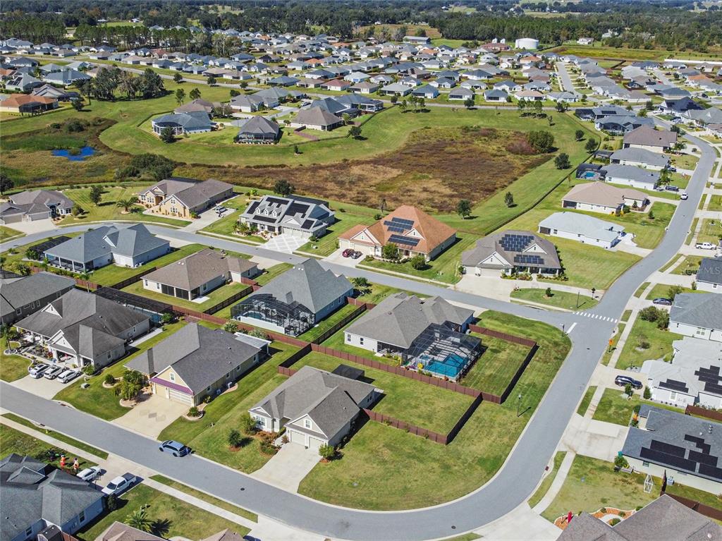 11202 Roz Way Oxford, FL 34484 - Photo 44 of 44 an aerial view of a house with a ocean view