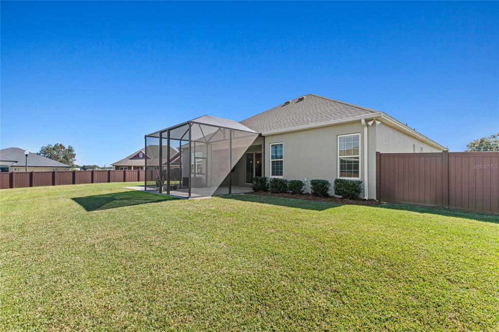 11202 Roz Way Oxford, FL 34484 - Photo 5 of 44 a view of a house with a yard