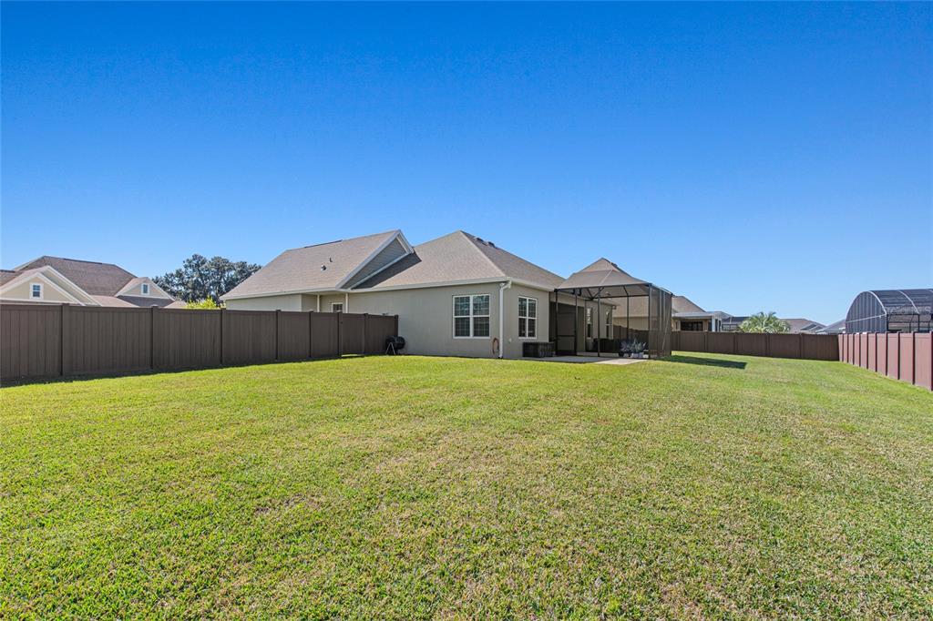 11202 Roz Way Oxford, FL 34484 - Photo 7 of 44 a house view with a outdoor space