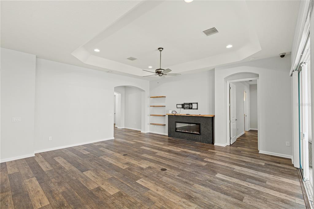 11202 Roz Way Oxford, FL 34484 - Photo 10 of 44 a view of a kitchen with a sink a refrigerator and cabinets