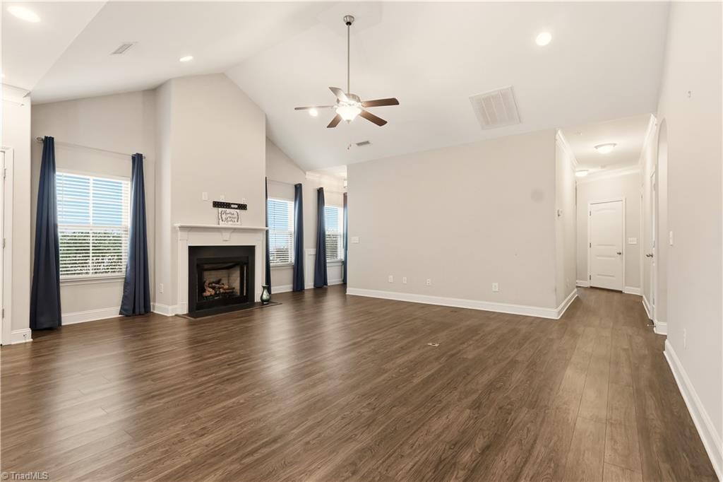 5624 Marblehead Drive Colfax, NC 27235 - Photo 6 of 36 Great room with vaulted ceiling and gas fireplace