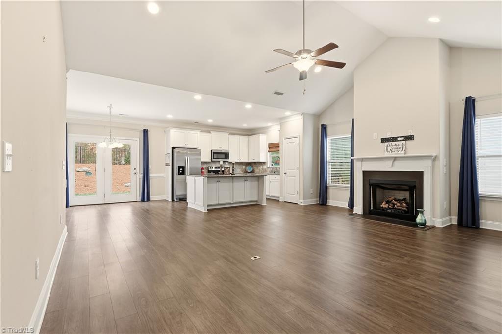 5624 Marblehead Drive Colfax, NC 27235 - Photo 7 of 36 Living room open to eating area and kitchen