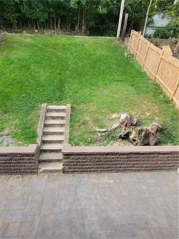 a view of a garden with side of street