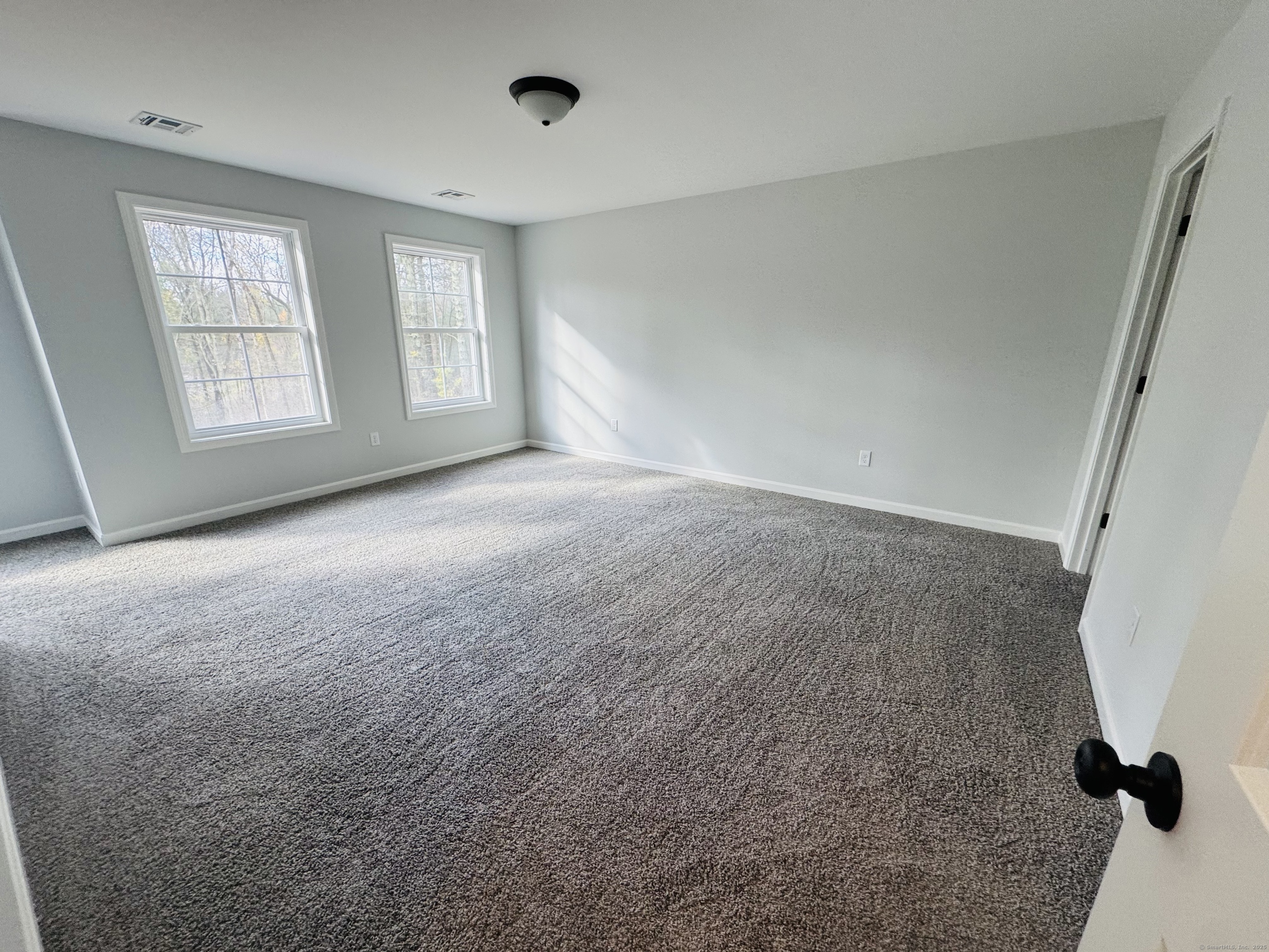 160 Ross Road Brooklyn, CT 06234 - Photo 10 of 13 an empty room with windows