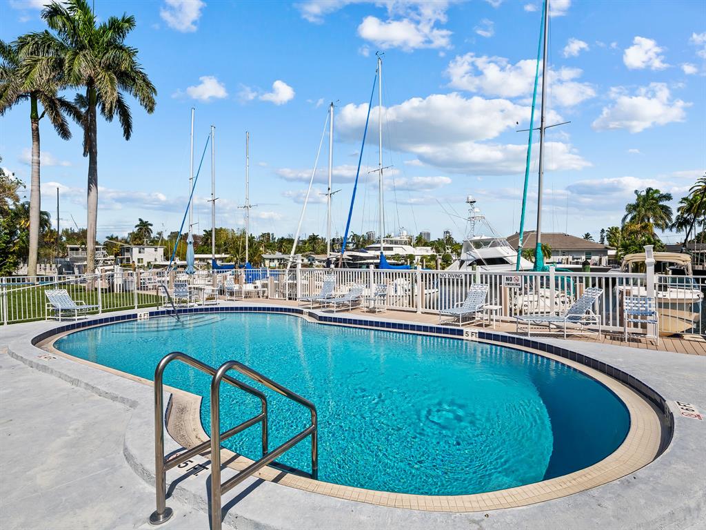 1475 Southeast 15th Street, Unit 311 Fort Lauderdale, FL 33316 - Photo 13 of 19 a view of a lake with chairs