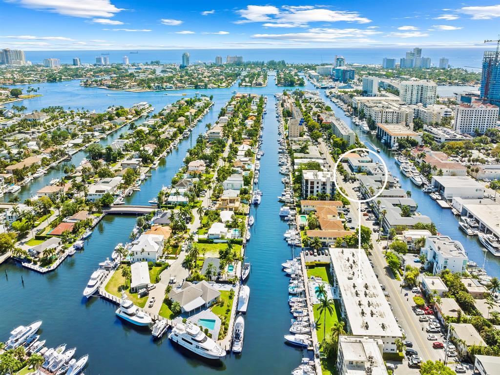 1475 Southeast 15th Street, Unit 311 Fort Lauderdale, FL 33316 - Photo 17 of 19 an aerial view of residential building and lake