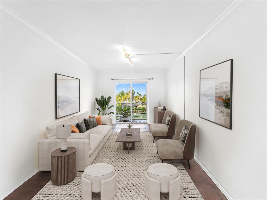 1475 Southeast 15th Street, Unit 311 Fort Lauderdale, FL 33316 - Photo 5 of 19 a living room with furniture and a large window