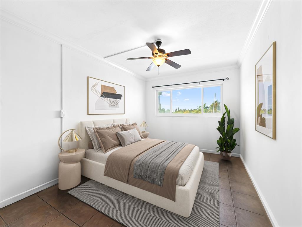 1475 Southeast 15th Street, Unit 311 Fort Lauderdale, FL 33316 - Photo 6 of 19 a bedroom with a bed couch and window